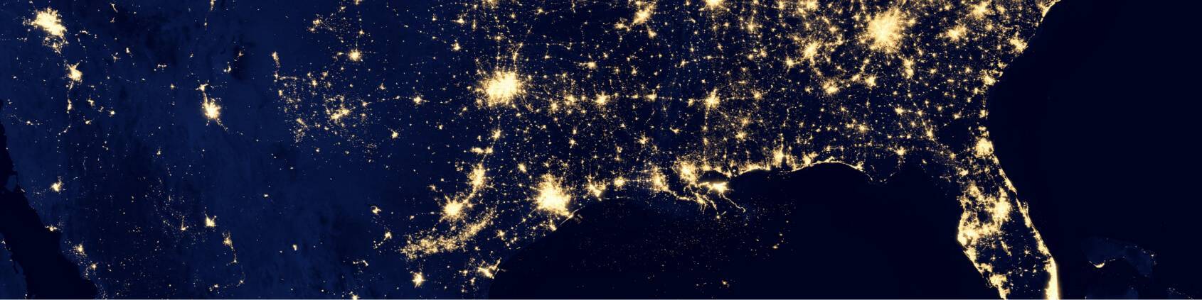 Satellite view of the US at night with a map of city lights 
