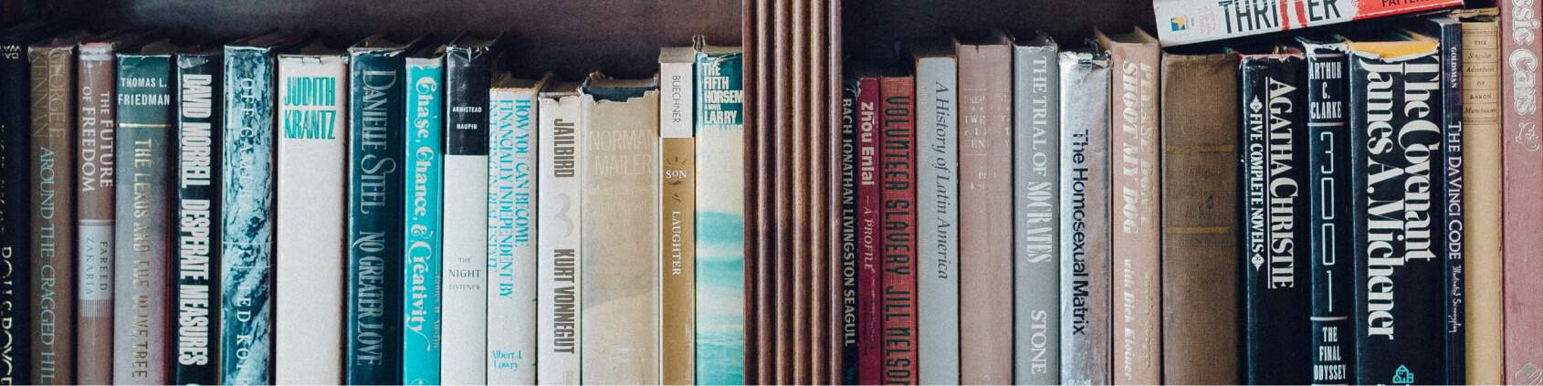 close up of the book spines on a book shelf